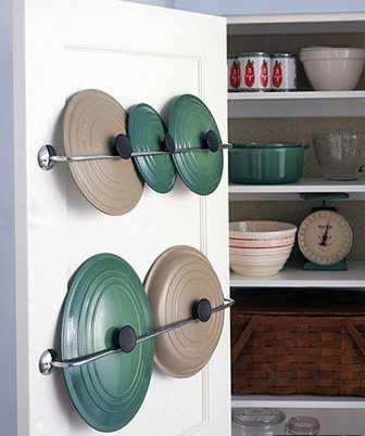 Stainless steel towel rack mounted inside the pantry.