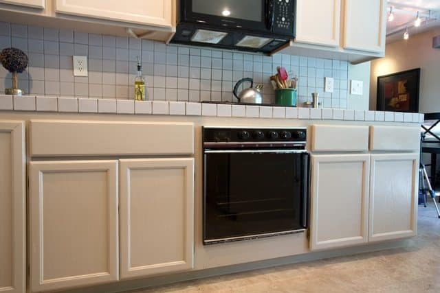 dated cabinets, appliances, and countertops.