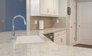 A newly remodeled kitchen counter featuring a luxurious, marbled design