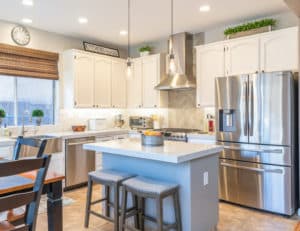 A newly remodeled kitchen complete with a stylish island and new countertops and cabinetry